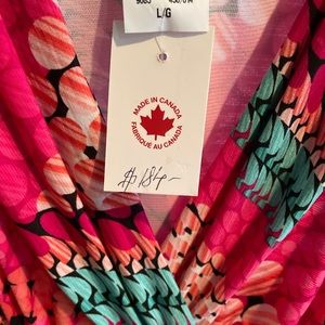 Boutique dress. Never worn. With tag. Perfect for warm weather event or getaway